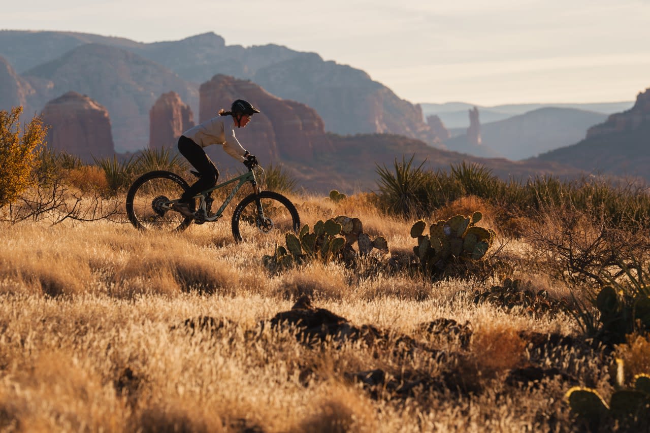 rider in the Sedona grass desert riding across a dry and expansive landscape