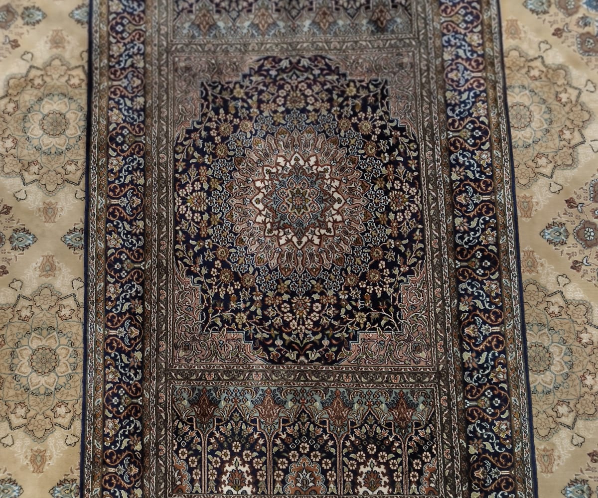Handmade Kashmiri carpet showing detailed pattern