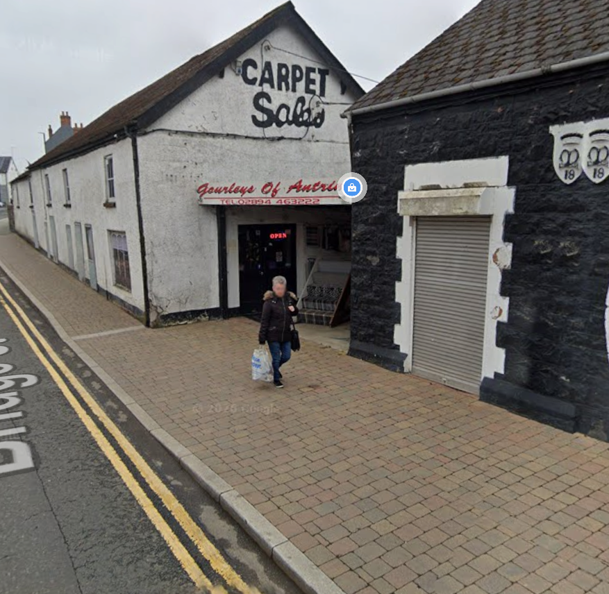 The Gourley's team standing in front of the Antrim shopfront
