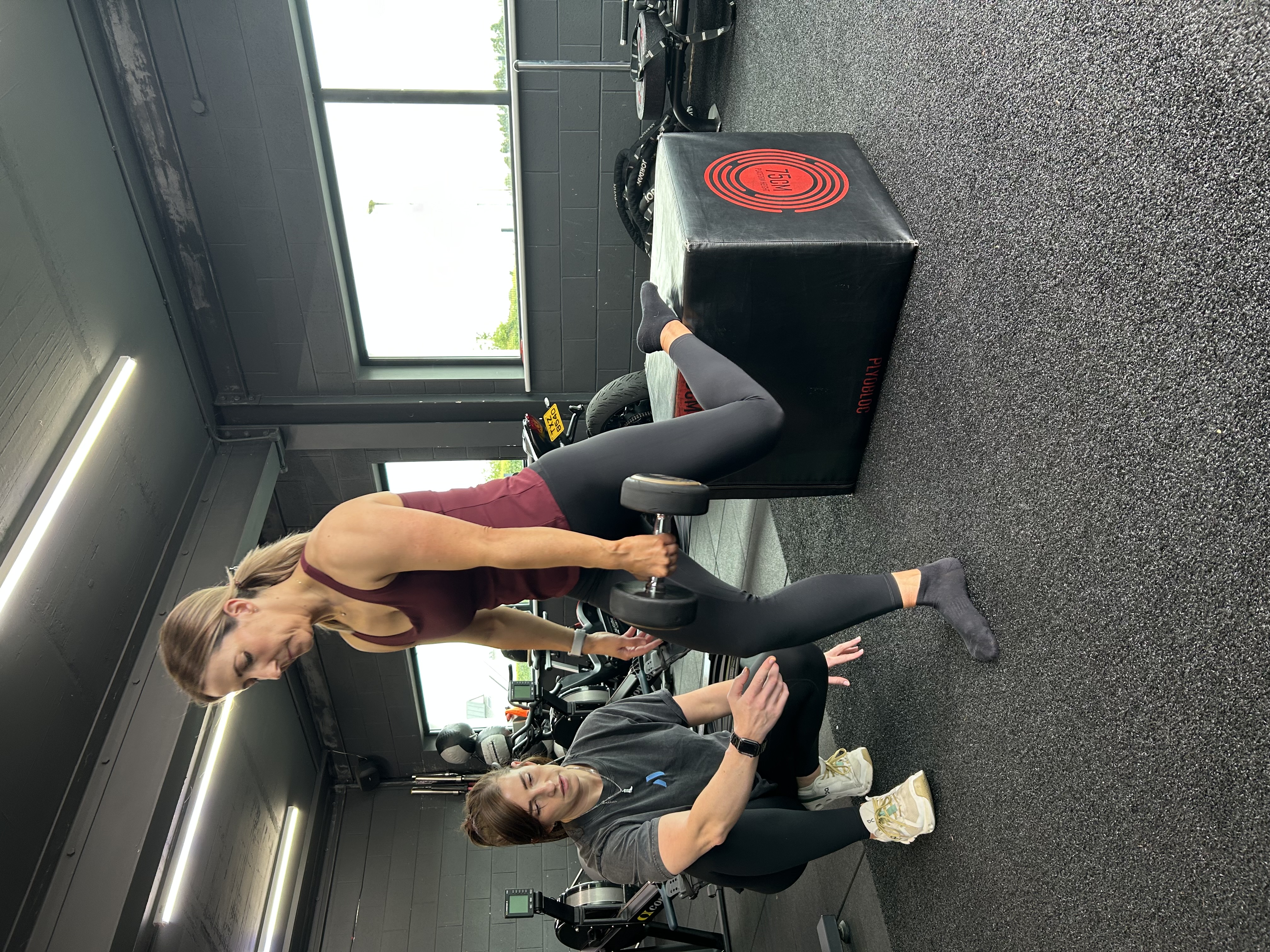 Sapphire coaching a client's training form at Alchemy, Ballymena