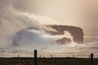 Natural arch, Dore Holm, in stormy seas