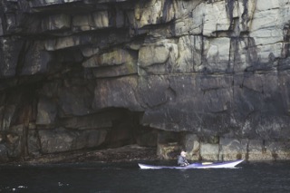 Kayaker below cliffs, Boddam