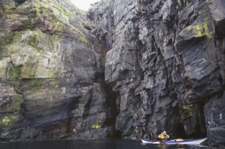 Kayaker below cliffs, Boddam