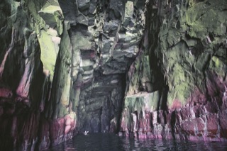 Kayaker in cave near Boddam