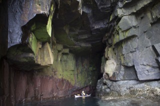 Kayaker in cave near Boddam