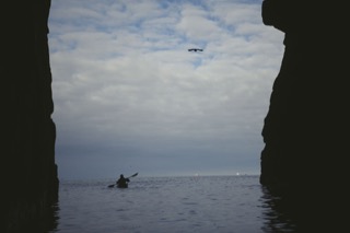 Kayaker in cave near Boddam