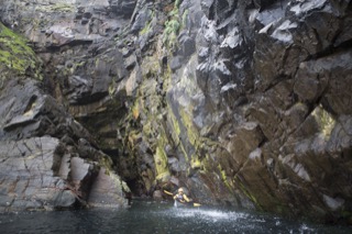 Kayaker below small waterfall, Boddam