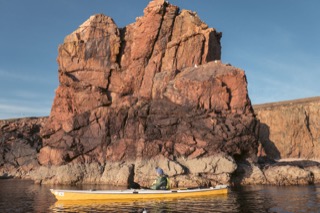 Kayaker among sea stacks, Braewick