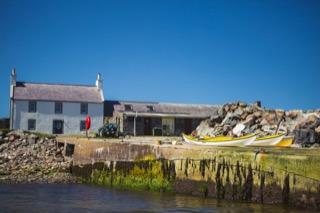 Kayaks ready to launch from the pier at Melby, Sandness
