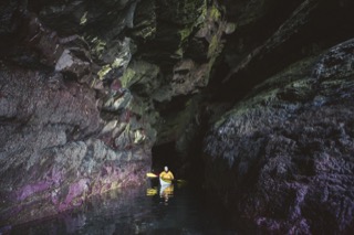 Kayaker in cave, Brindister cliffs