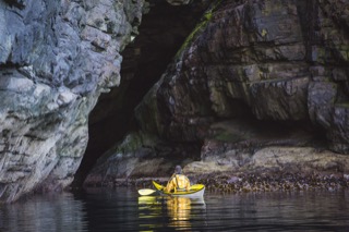 Kayaker in cave, Brindister cliffs