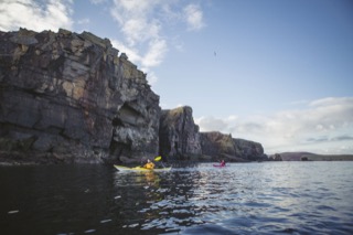 Kayakers below Brindister cliffs