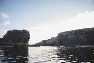 Kayakers below Brindister cliffs