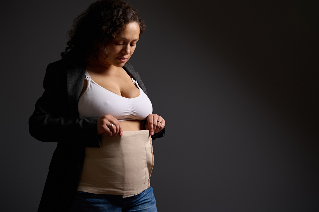 woman wearing a supportive brace post c-section