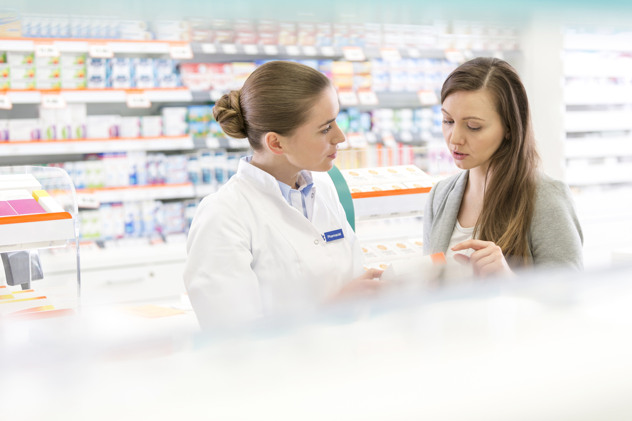 woman discussing menopur with her pharmacist