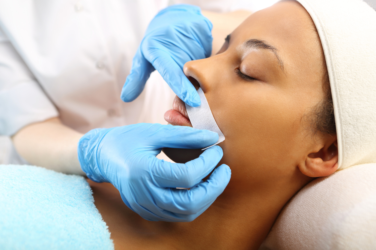 woman getting waxed above the lip