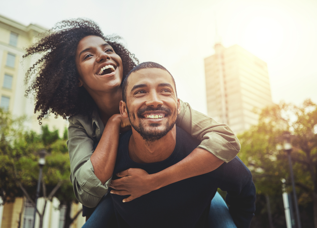 man giving a woman a piggyback ride