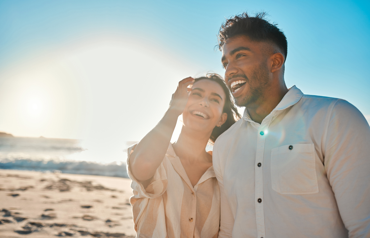 couple smiling at the beach