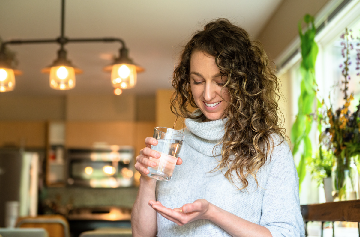 woman taking medication