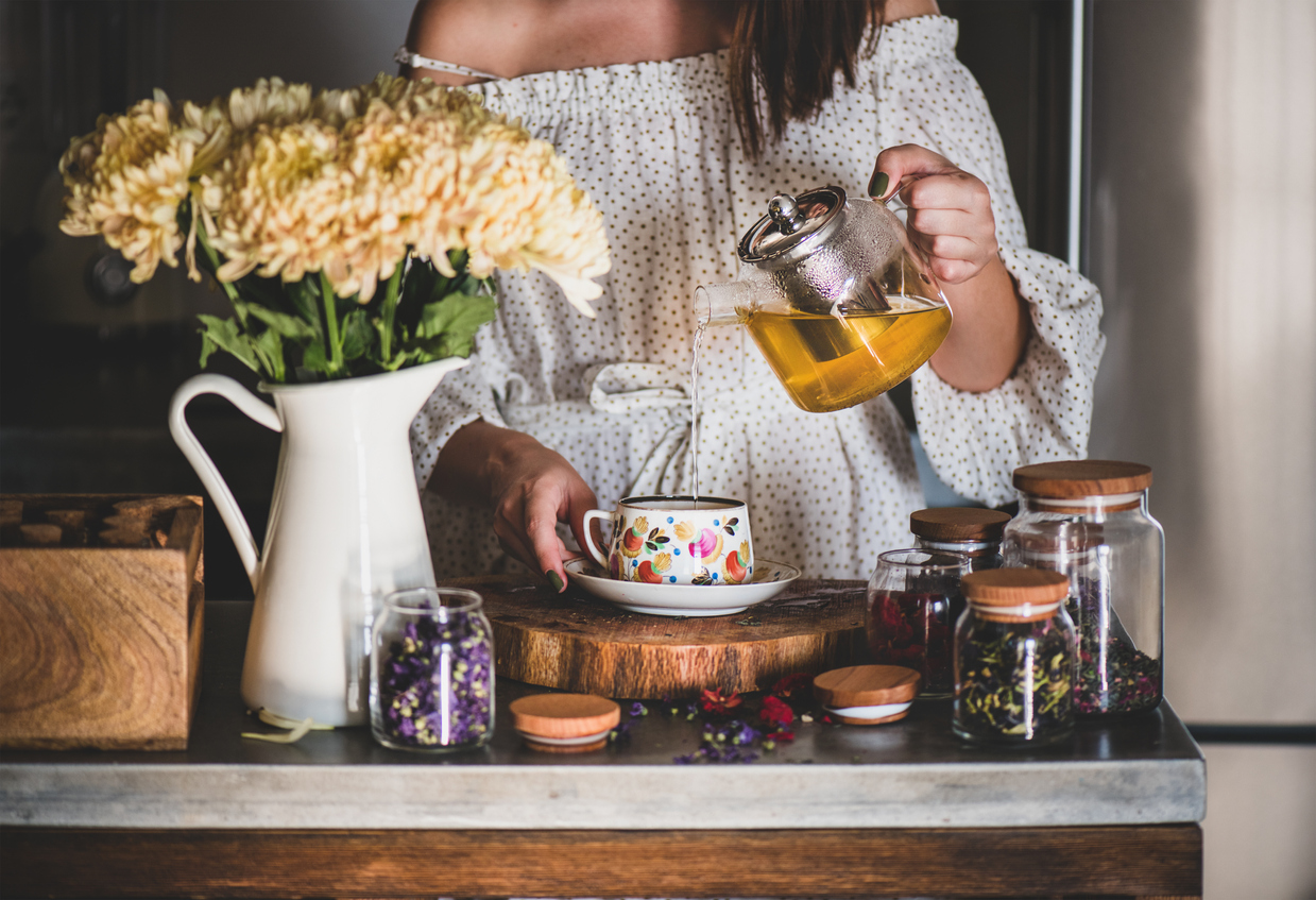 woman making herbal tea