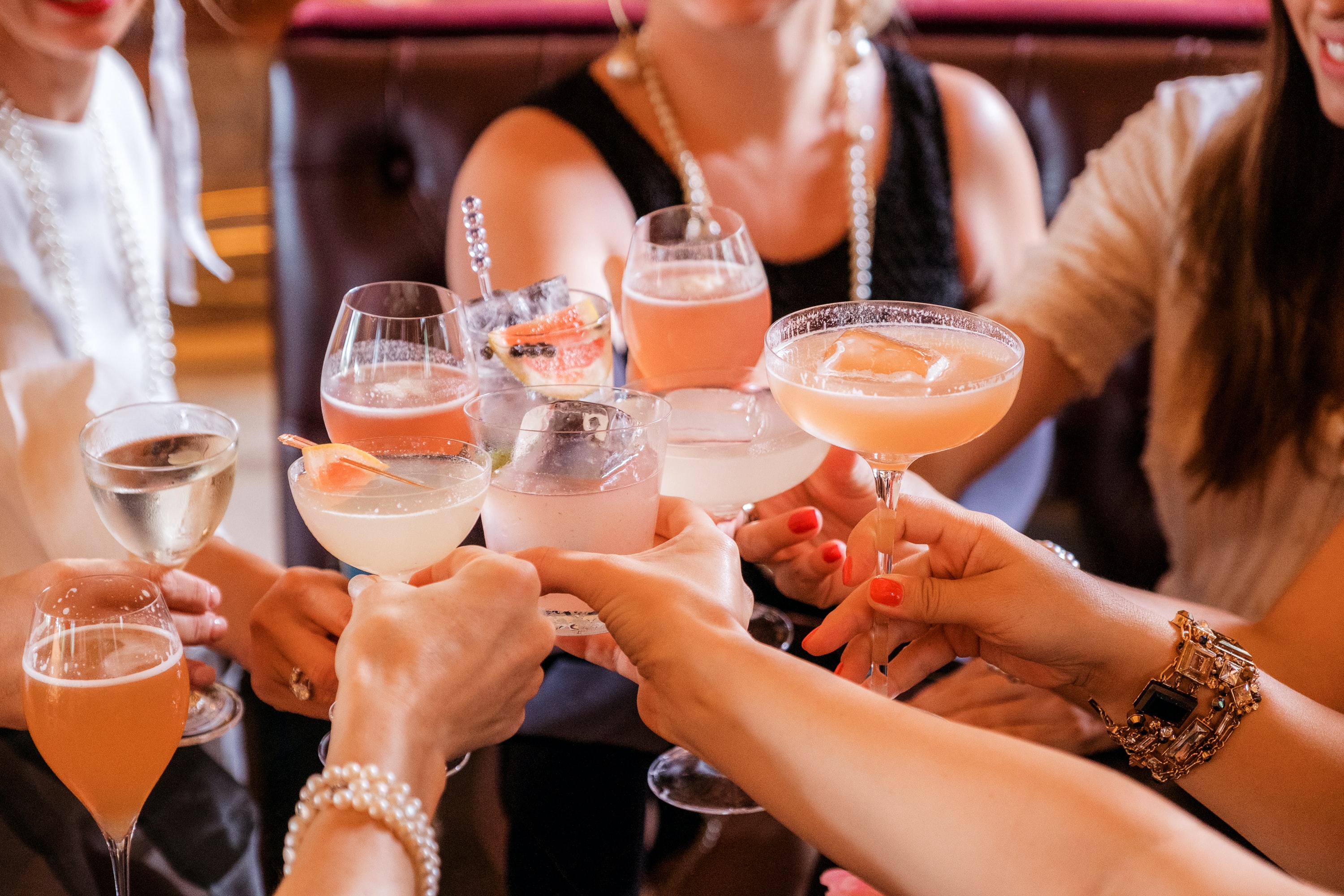 group of women enjoying cocktails