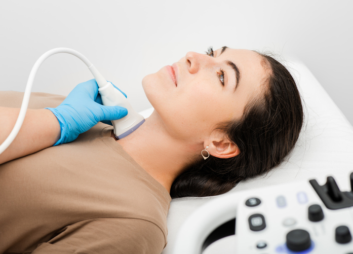 woman having an ultrasound on her thyroid