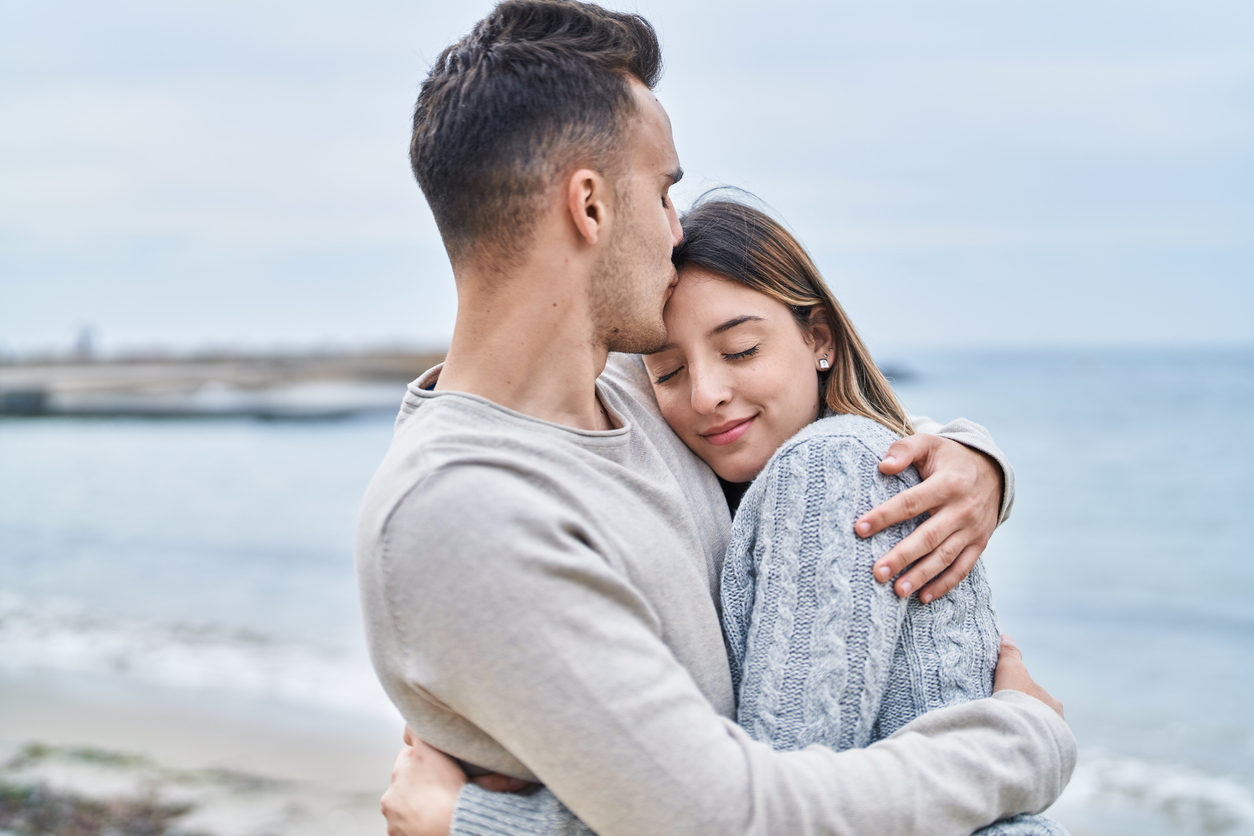 couple embracing at the beach