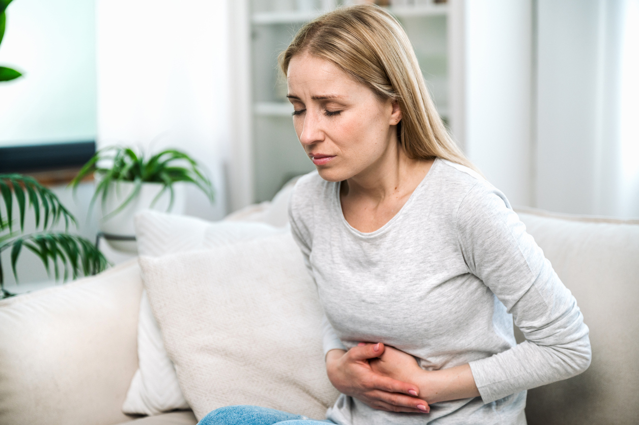 woman suffering from irritable bowel syndrome or IBS