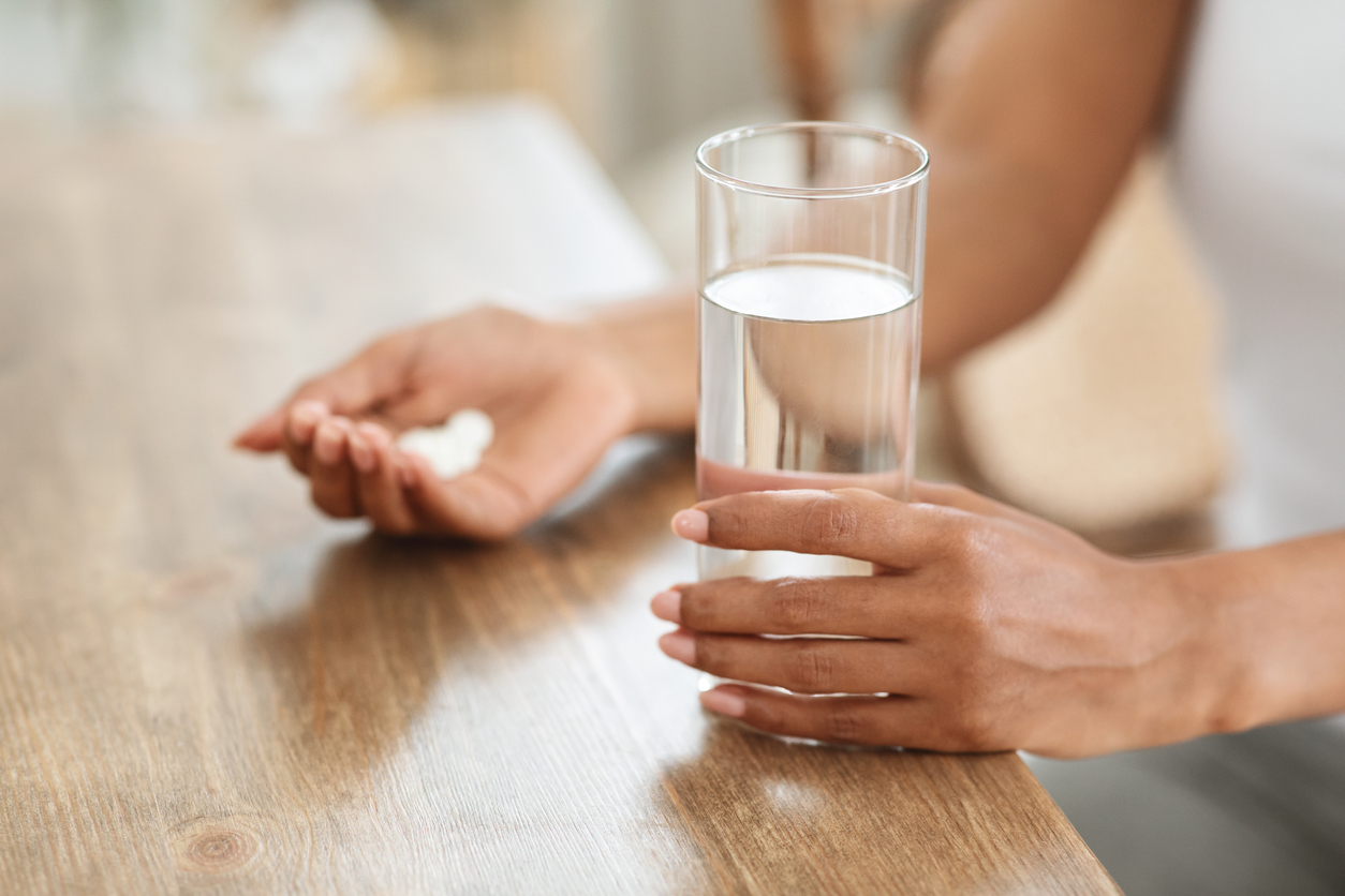 woman taking magnesium for morning sickness