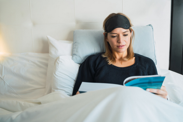 woman reading in bed