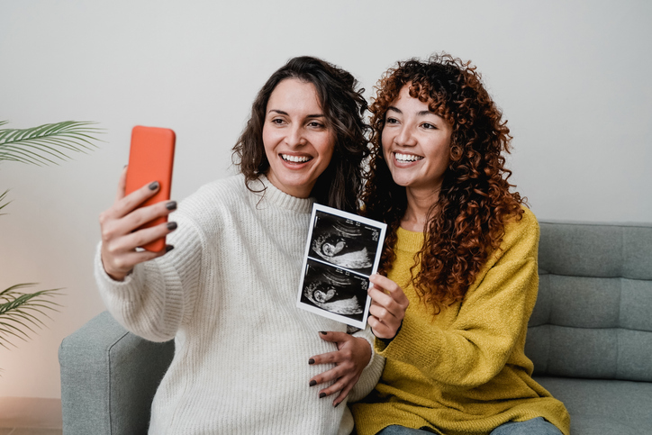 woman with her surrogate taking selfies