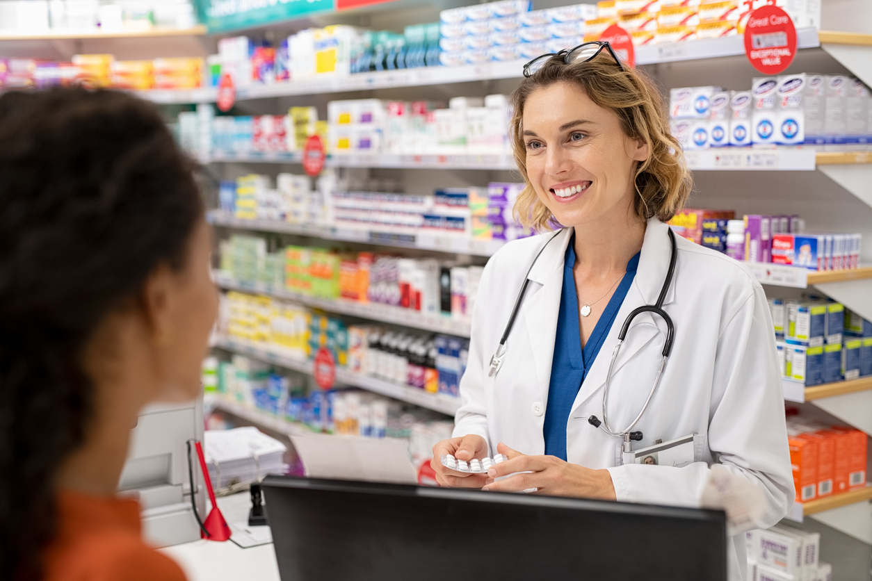 woman talking with pharmacist about the postpartum depression pill