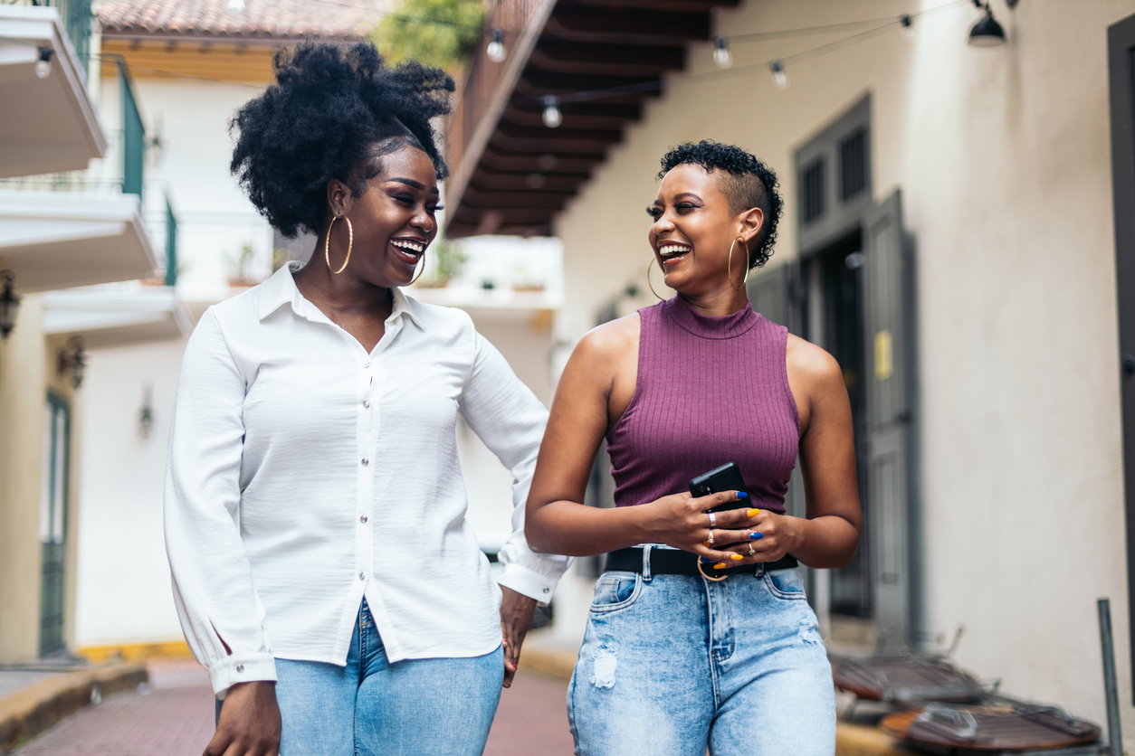 two women strolling and laughing