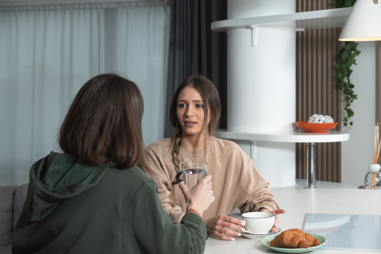 mom talking to adult daughter