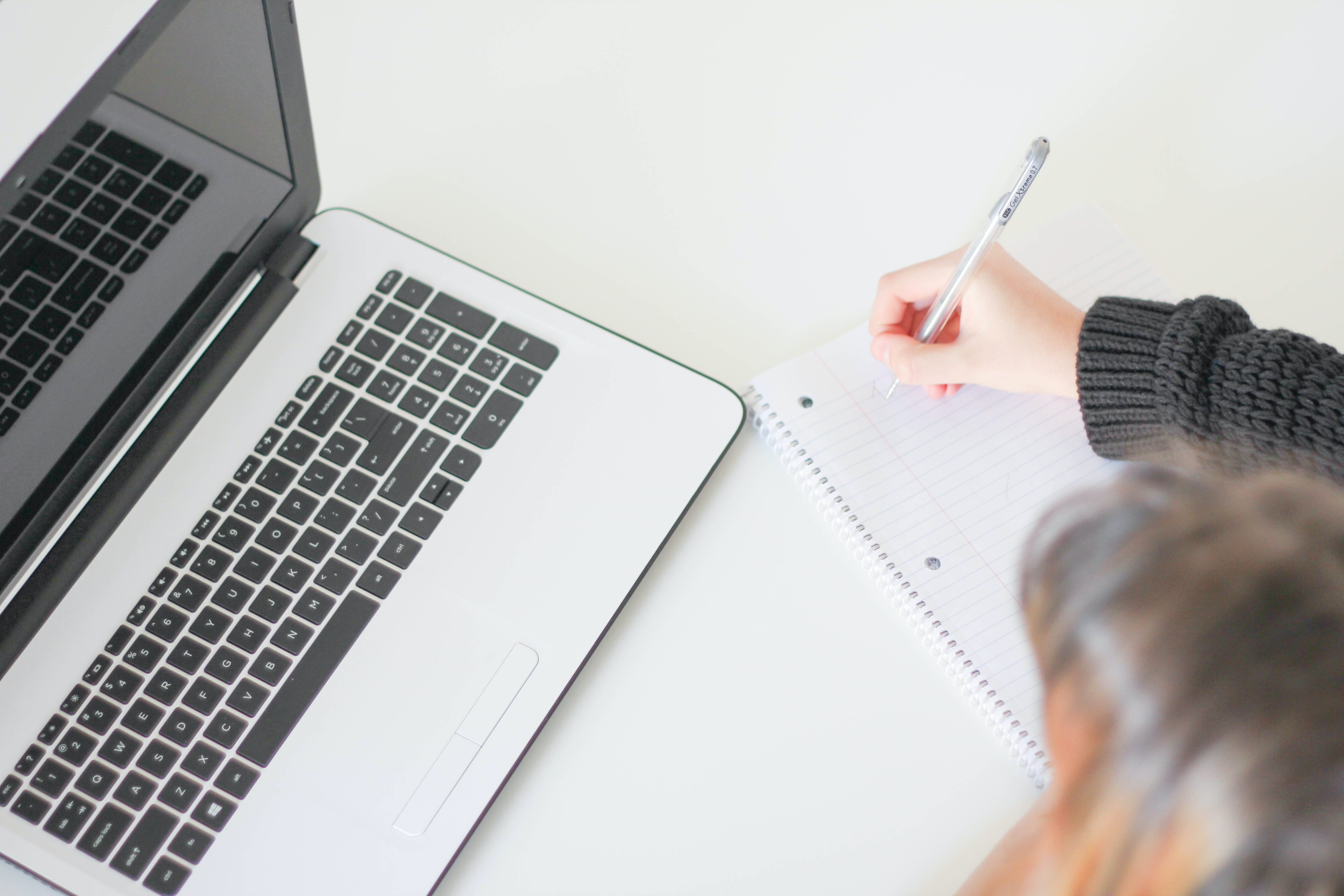 woman doing fertility supplement research at her computer