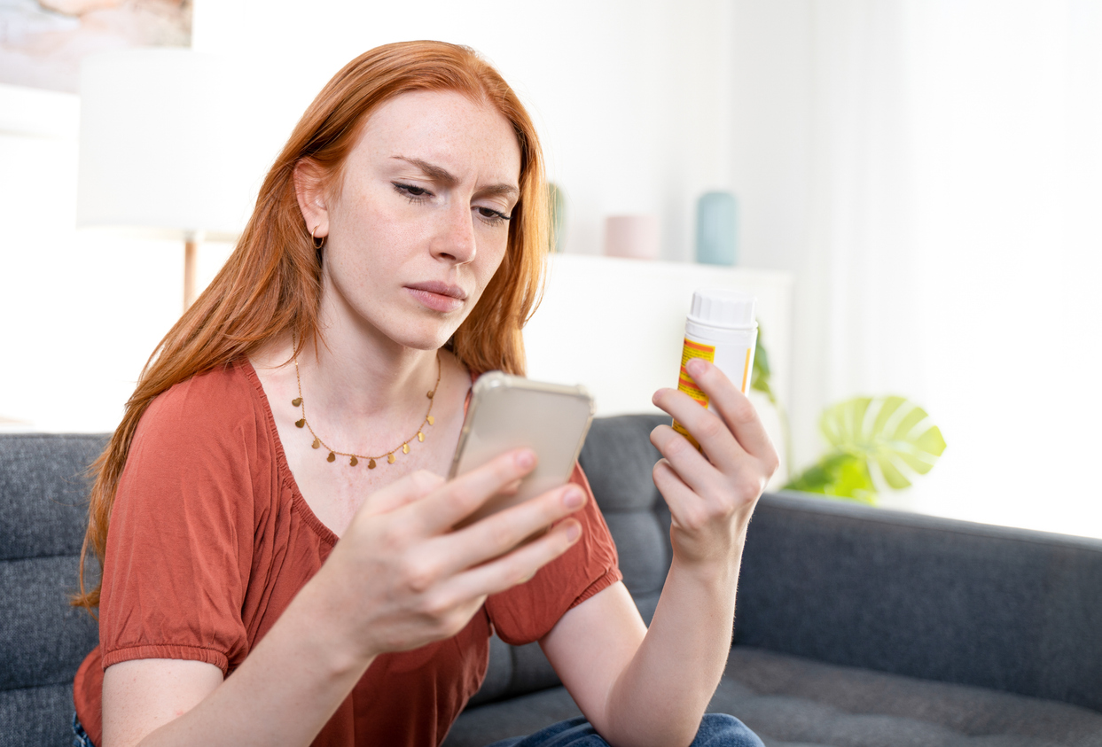 woman looking up prescription instructions for the postpartum depression pill