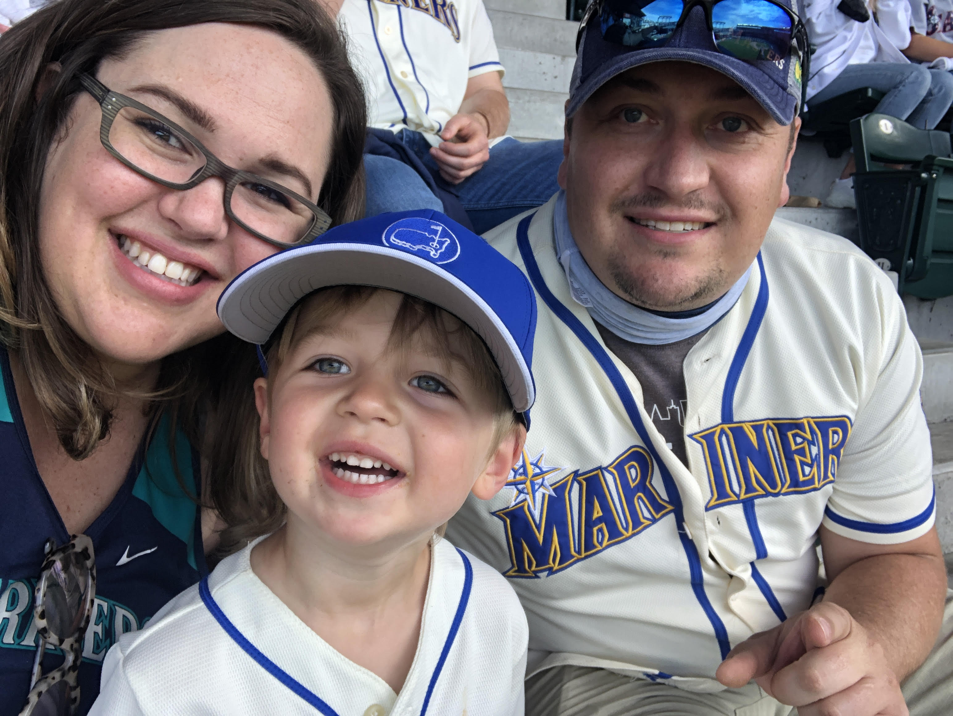 jenny cooke malstrom with her family at a baseball game