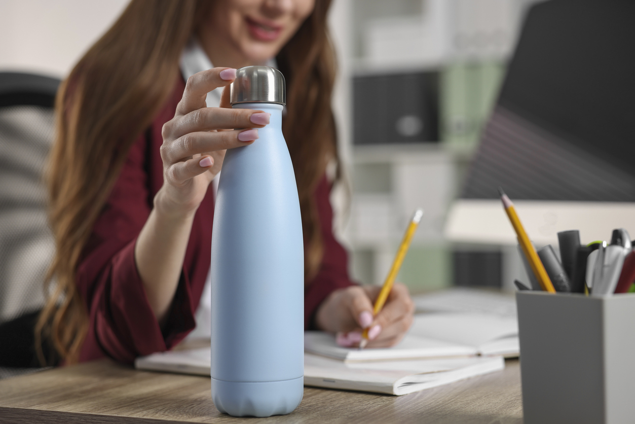 woman touching her water bottle