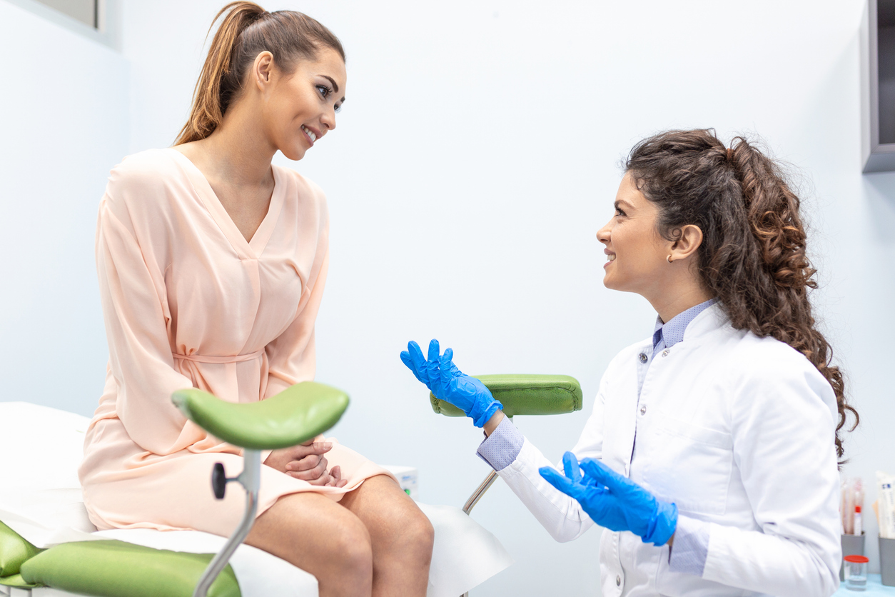 woman and obgyn talking before pelvic exam