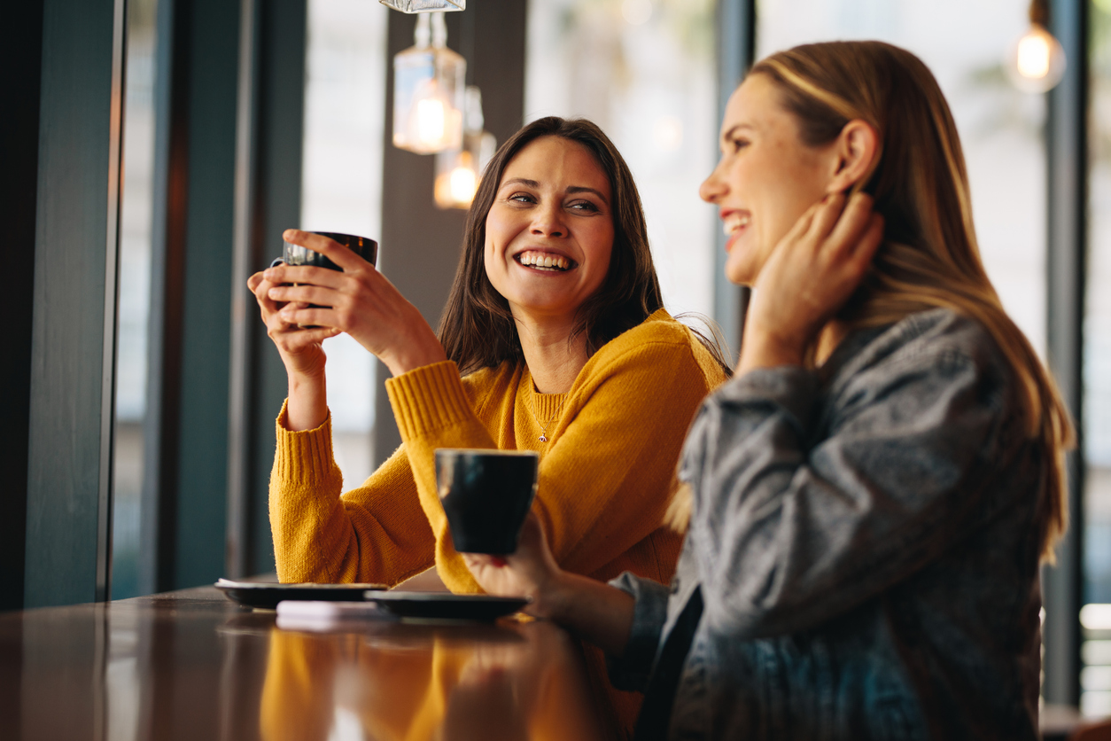 women talking over coffee