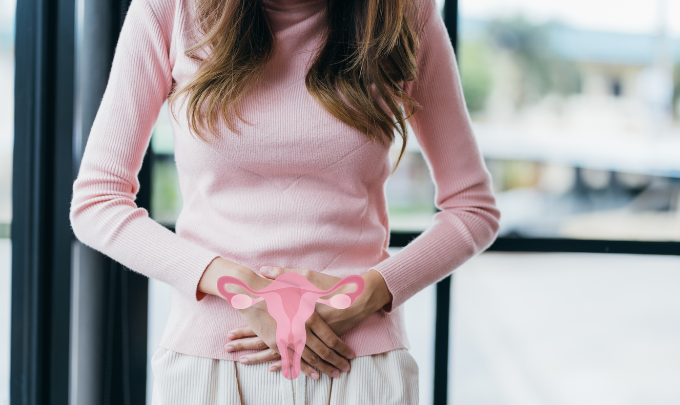 woman with cramps holding her abdomen