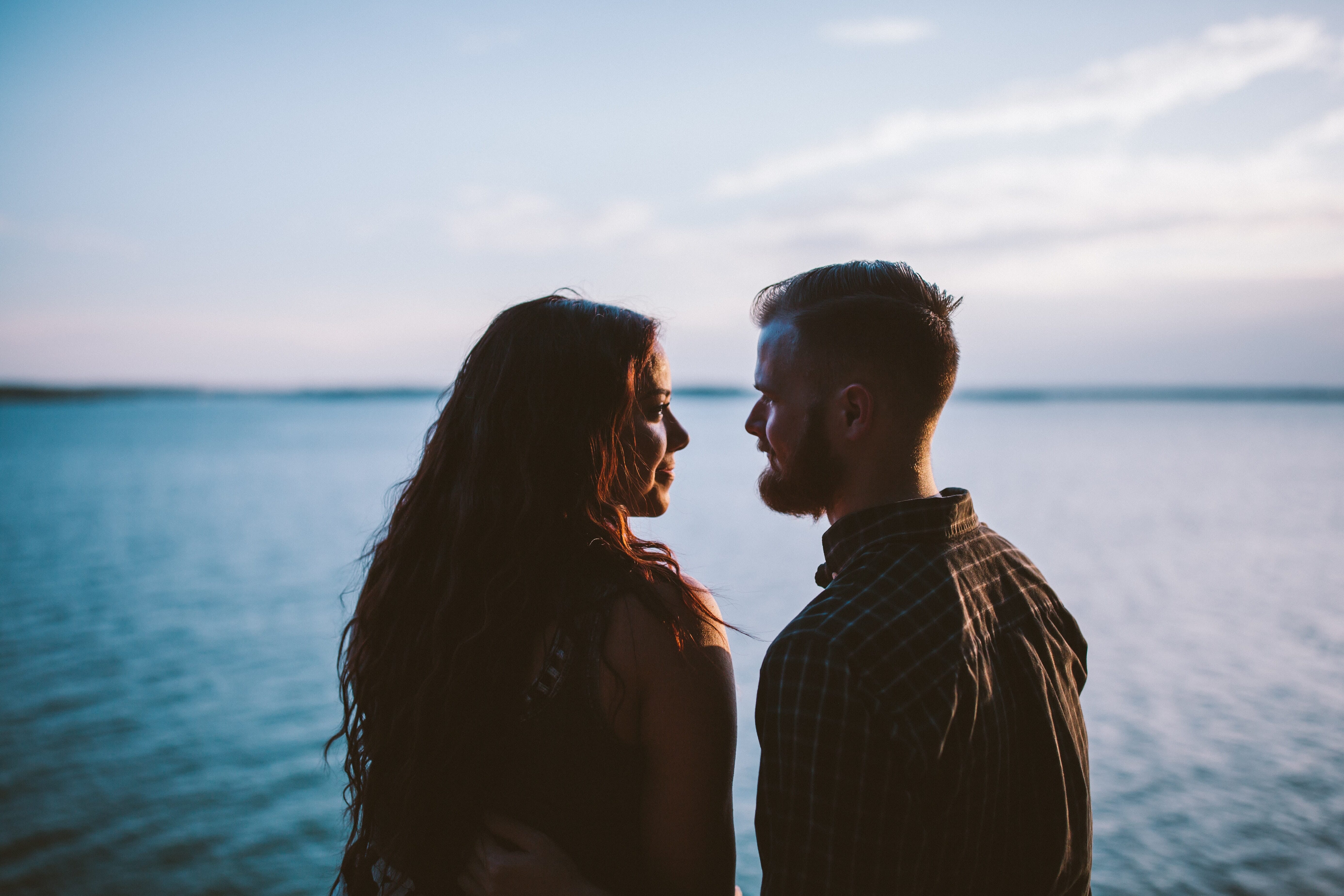 couple looking into each other's eyes at the beach