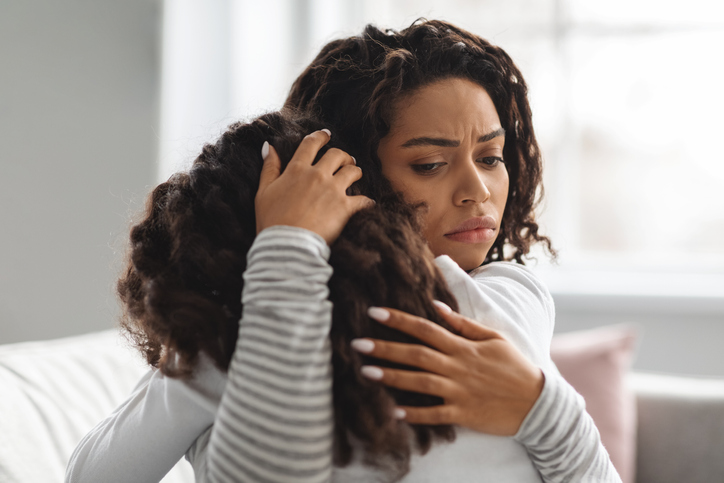 mother holding her daughter