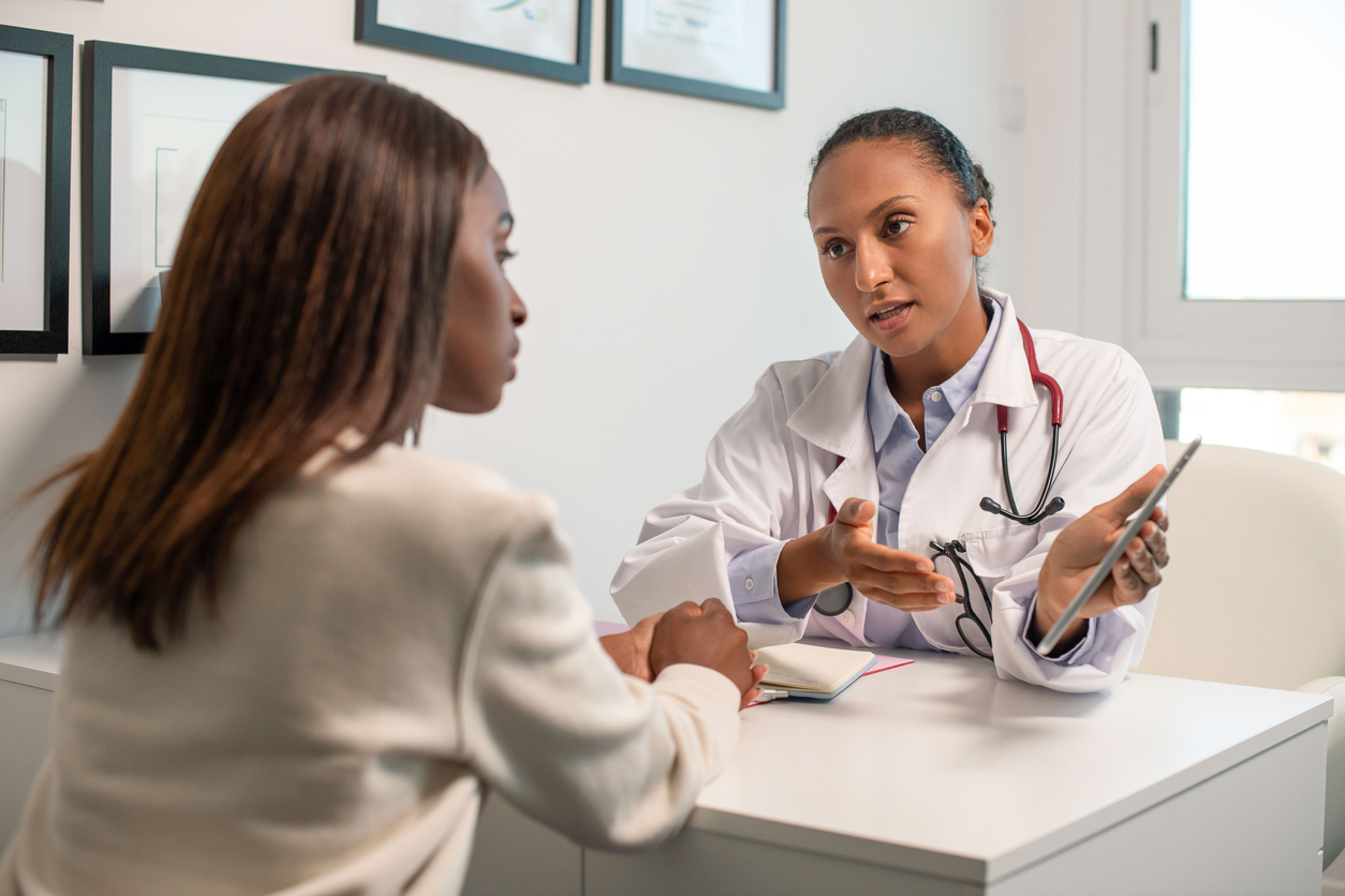 doctor giving patient results of a full thyroid panel