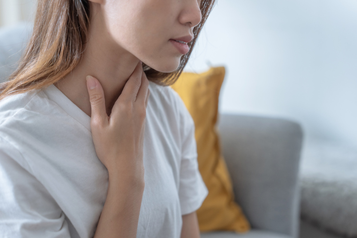 woman massaging her neck