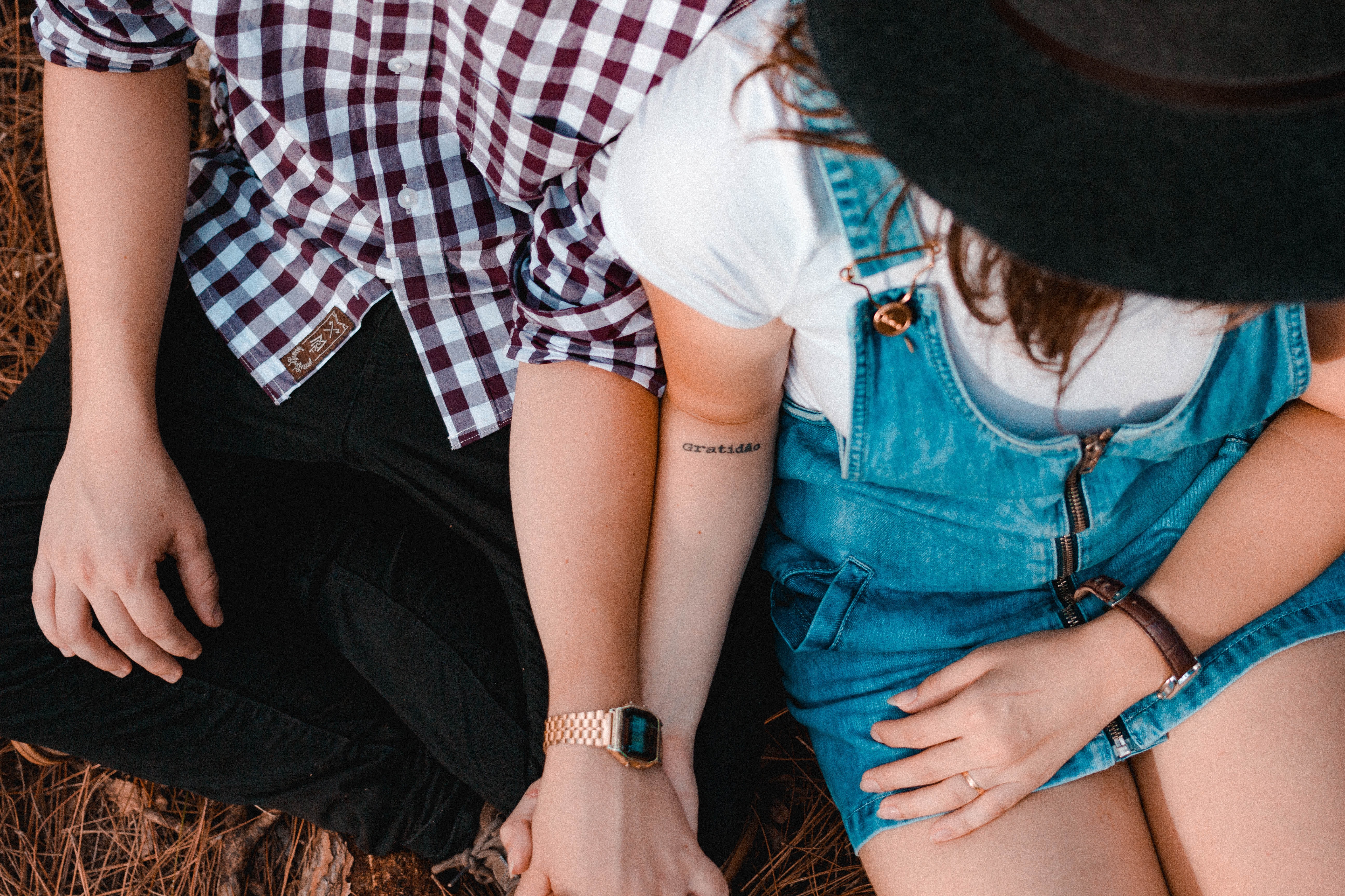 woman and man holding hands outdoors