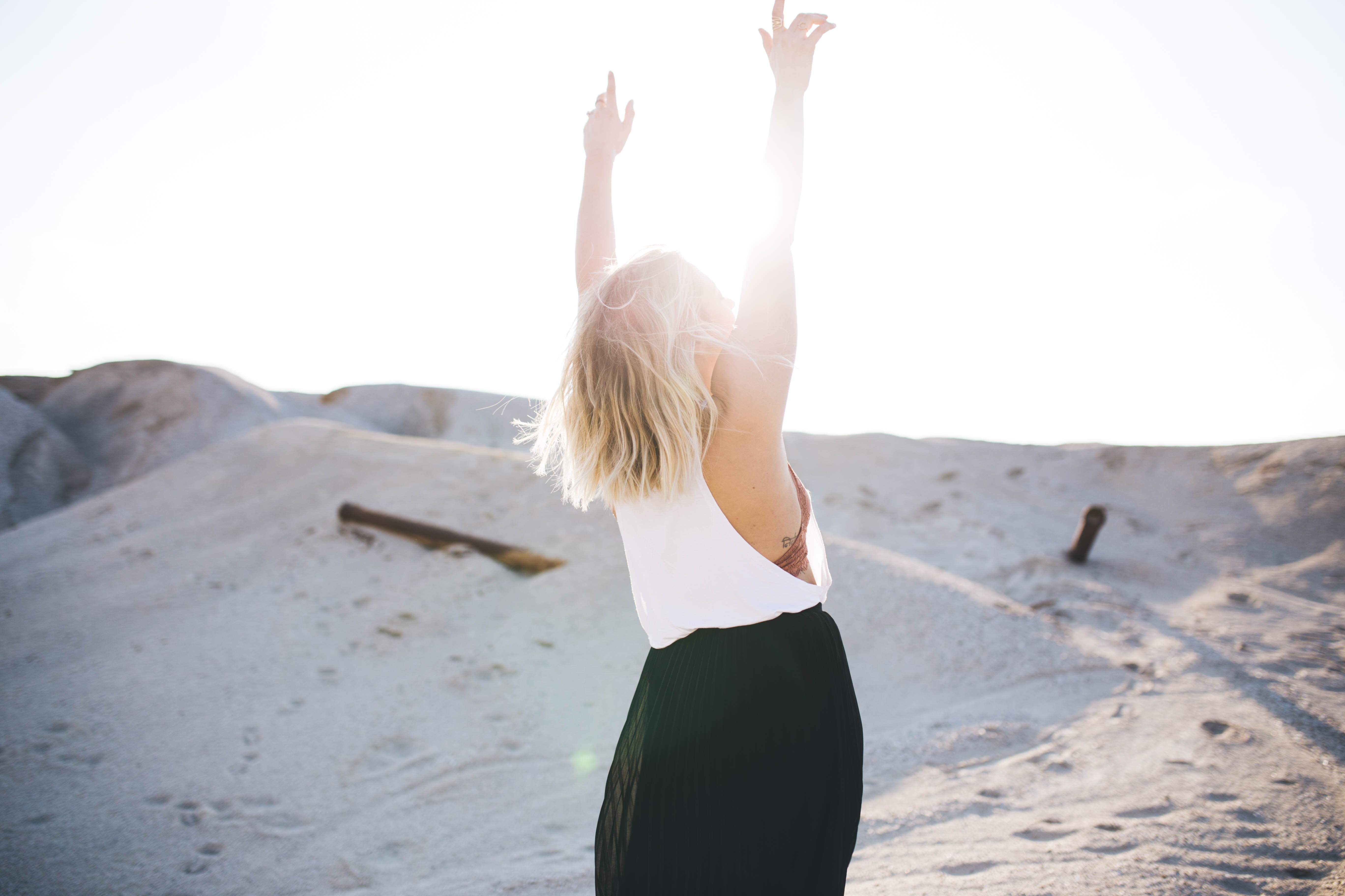 woman enjoying sunrise on the beach