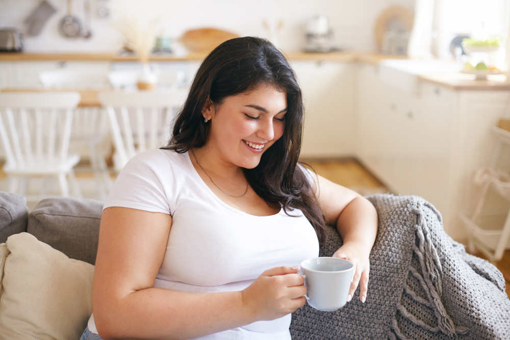 woman drinking a cup of coffee while ttc