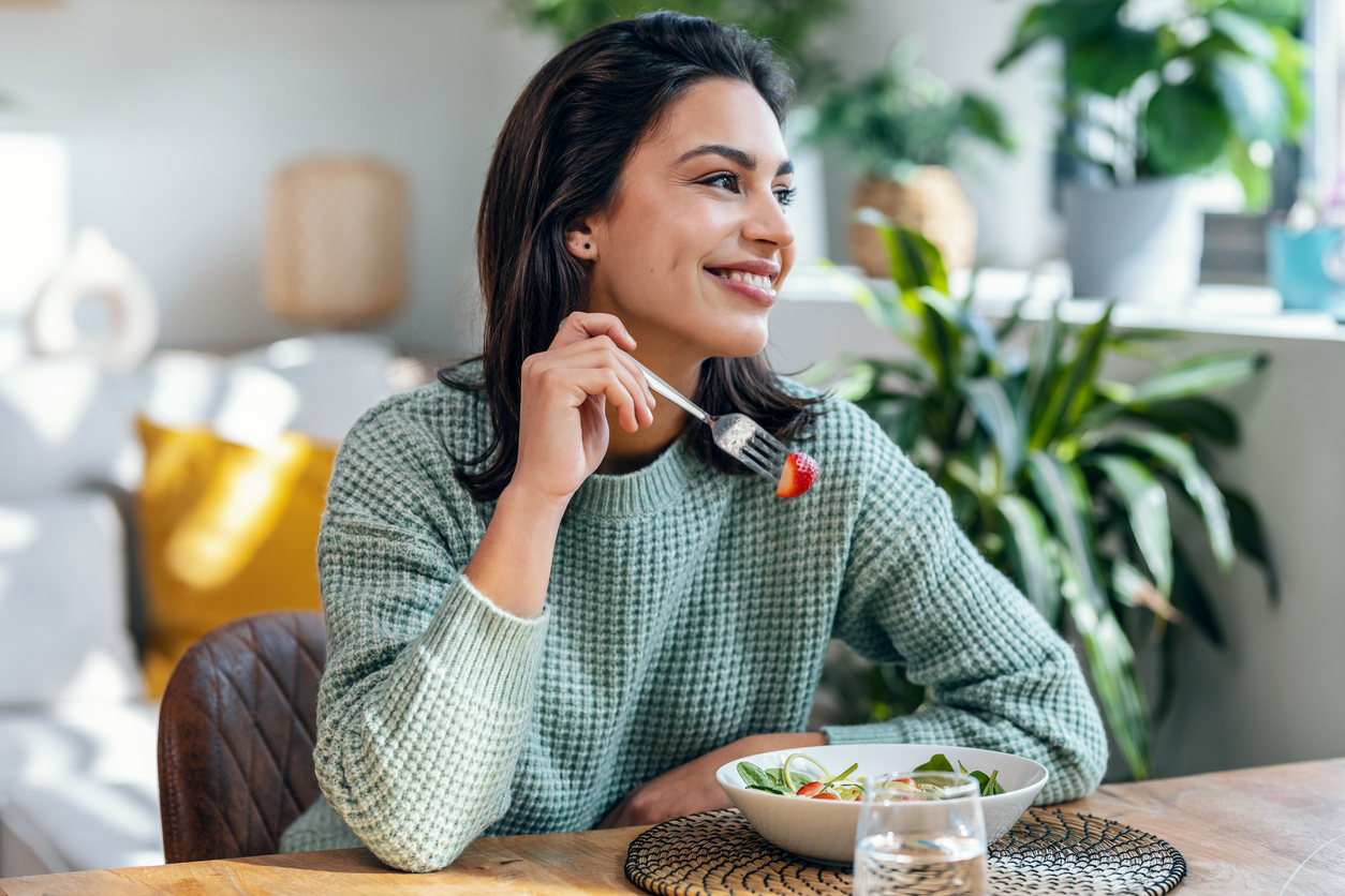 woman eating strawberries