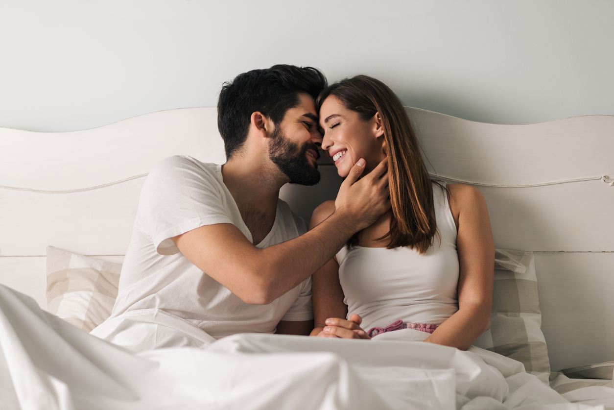 happy couple in bed